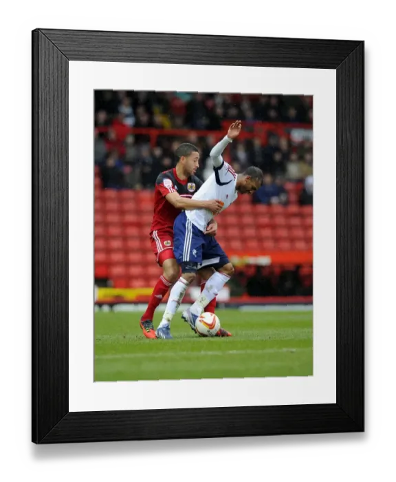 Framed Print : Intense Rivalry: Nyatanga vs. Ngog - Battle for Ball Possession, Bristol City vs. Bolton Wanderers