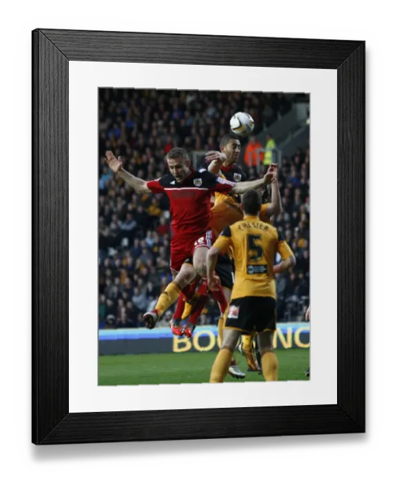 Framed Print : Bristol City's Lewin Nyatanga Soars High in Championship Clash vs Hull City (April 2013)