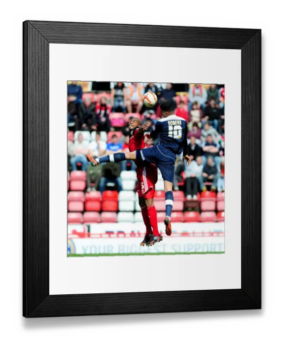 Framed Print : Aerial Clash: Marvin Elliott vs. Oscar Gobern, Bristol City vs. Huddersfield Town, Npower Championship Framed Print : Aerial Clash: Marvin Elliott vs. Oscar Gobern, Bristol City vs. Huddersfield Town, Npower Championship