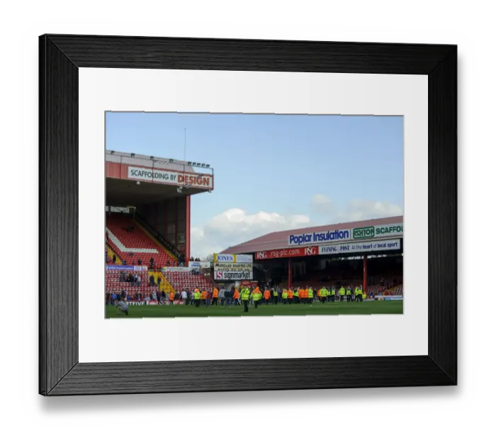 Framed Print : Bristol City Fans Rush the Field in Distress After 3-1 Defeat to Huddersfield Town Framed Print : Bristol City Fans Rush the Field in Distress After 3-1 Defeat to Huddersfield Town