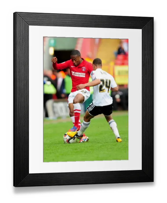 Framed Print : Intense Moment: Bobby Reid vs. Callum Harriott - A Hard-Fought Tackle in the Npower Championship Clash Between Charlton Athletic and Bristol City