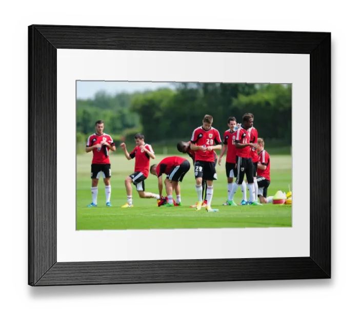 Framed Print : Bristol City Football Squad at Pre-Season Training: A Moment of Relaxation