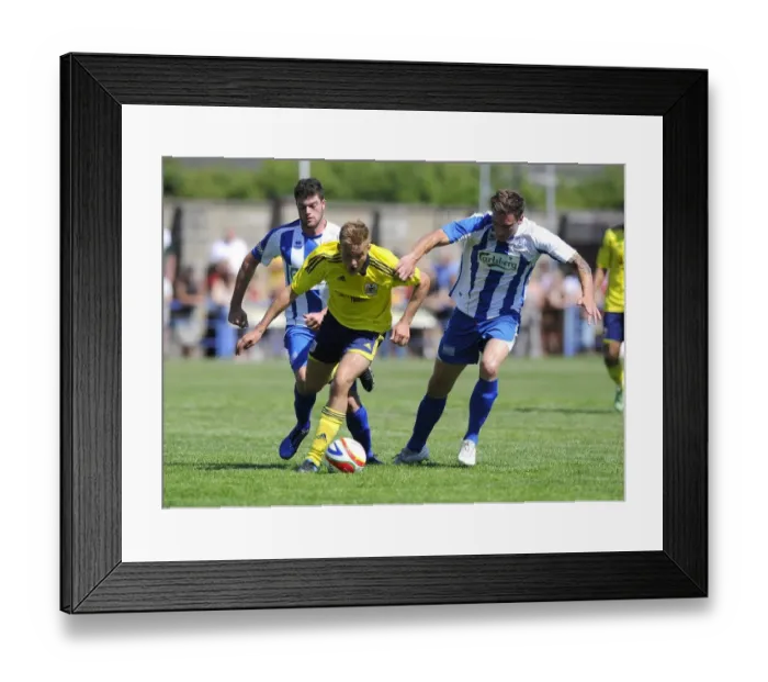 Framed Print : Bristol City's Rhys Jordan Fights for Possession Against Clevedon Town Defense in Pre-Season Friendly Framed Print : Bristol City's Rhys Jordan Fights for Possession Against Clevedon Town Defense in Pre-Season Friendly