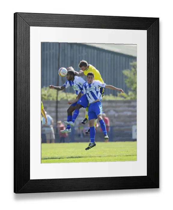 Framed Print : Aden Flint Wins a Header: Bristol City's Pre-Season Victory over Clevedon Town (July 2013) Framed Print : Aden Flint Wins a Header: Bristol City's Pre-Season Victory over Clevedon Town (July 2013)