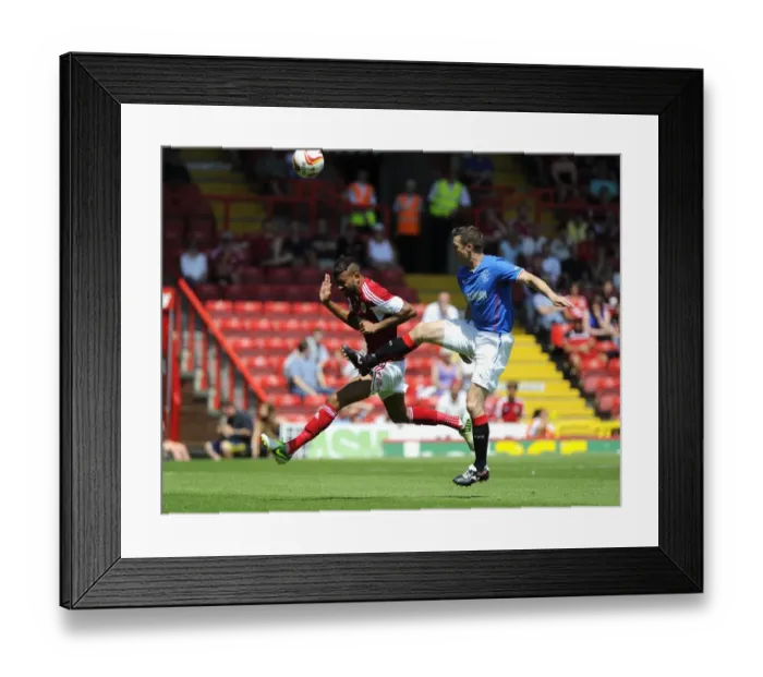 Framed Print : Intense Aerial Battle: Fontaine vs Daly - Bristol City vs Glasgow Rangers