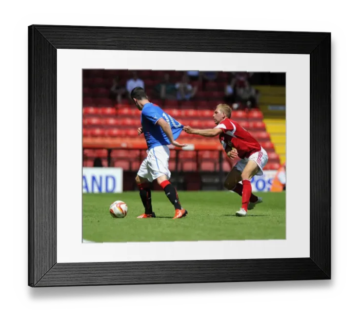 Framed Print : Intense Rivalry: Wagstaff vs Clark Battle on the Pitch - Bristol City vs Glasgow Rangers, 2013