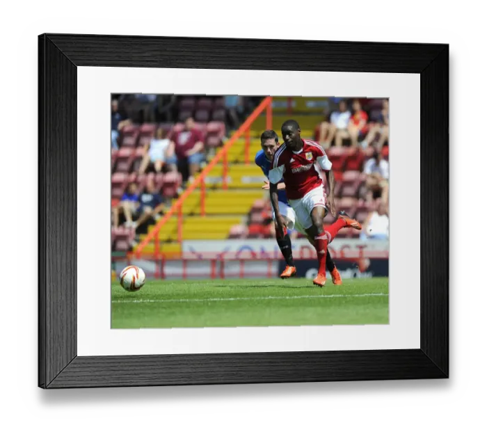 Framed Print : Jordan Wynter Charges Forward: Bristol City vs. Glasgow Rangers Pre-Season Showdown
