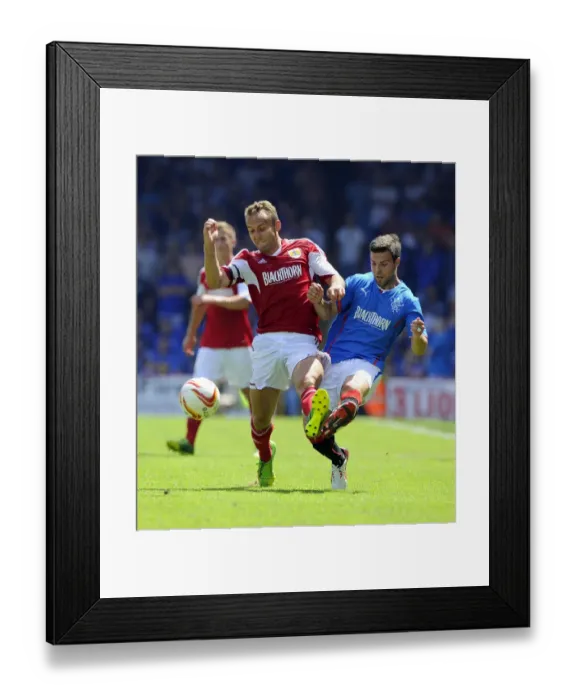 Framed Print : Intense Rivalry on the Field: Liam Kelly vs. Richard Foster - Bristol City vs. Glasgow Rangers