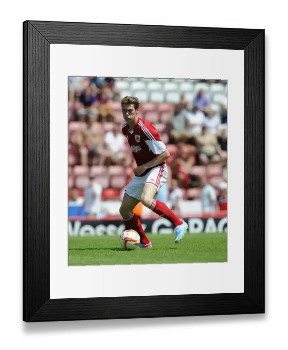 Framed Print : Bristol City's Luke Dobie Faces Off Against Glasgow Rangers at Ashton Gate Stadium (2013)