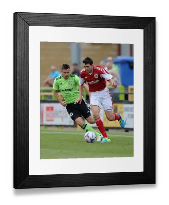 Framed Print : Brendan Maloney Escapes Forest Green Rovers Defender Andrew Mangan: Forest Green Rovers vs. Bristol City Preseason Clash, 2013 Framed Print : Brendan Maloney Escapes Forest Green Rovers Defender Andrew Mangan: Forest Green Rovers vs. Bristol City Preseason Clash, 2013