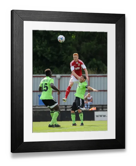 Framed Print : Ryan Taylor vs Jared Hodgkiss: A Clash in Preseason 2013 Football Rivalry - Forest Green Rovers vs Bristol City Framed Print : Ryan Taylor vs Jared Hodgkiss: A Clash in Preseason 2013 Football Rivalry - Forest Green Rovers vs Bristol City