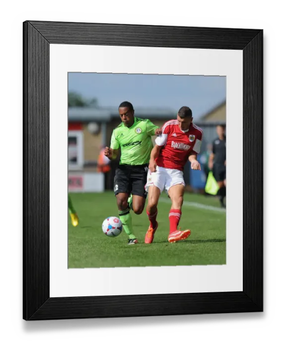 Framed Print : Battling for Supremacy: Forest Green Rovers Ed Asafu-Adjaye vs. Bristol City's Derrick Williams Framed Print : Battling for Supremacy: Forest Green Rovers Ed Asafu-Adjaye vs. Bristol City's Derrick Williams