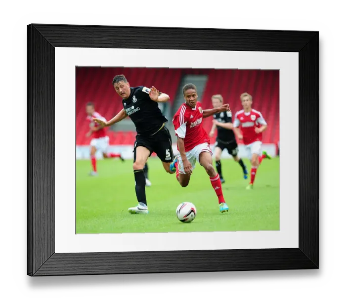 Framed Print : Bobby Reid Sprints Past Tommy Elphick: A Thrilling Moment from Bristol City's Pre-Season Clash with Bournemouth (27 / 03 / 2013)