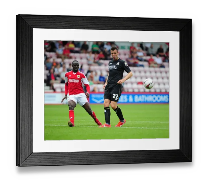Framed Print : Bristol City's Albert Adomah Crosses the Ball in Pre-Season Clash vs Bournemouth Framed Print : Bristol City's Albert Adomah Crosses the Ball in Pre-Season Clash vs Bournemouth
