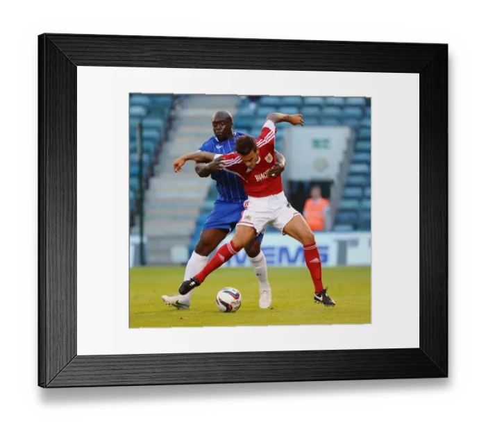 Framed Print : Maron Pack vs. Adebayo Akinfenwa: Battle in the First Round of the Capital One Cup at Priestfield Stadium (Gillingham V Bristol City) Framed Print : Maron Pack vs. Adebayo Akinfenwa: Battle in the First Round of the Capital One Cup at Priestfield Stadium (Gillingham V Bristol City)