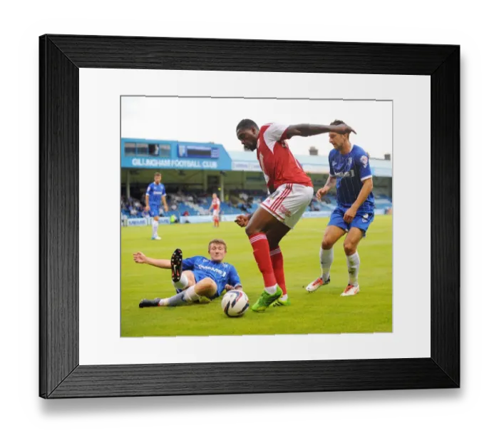 Framed Print : Jay Emmanuel-Thomas Tackles Gillingham Defense in Capital One Cup Clash Framed Print : Jay Emmanuel-Thomas Tackles Gillingham Defense in Capital One Cup Clash