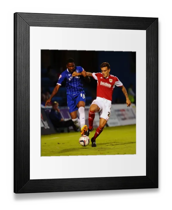 Framed Print : Maron Pack vs. Antonio German: Battle for the Ball in Gillingham vs. Bristol City (2013) Framed Print : Maron Pack vs. Antonio German: Battle for the Ball in Gillingham vs. Bristol City (2013)