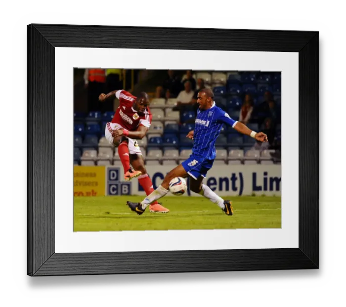 Framed Print : Maron Harewood's Shot Blocked by Leon Legge in Gillingham vs. Bristol City Football Match, 2013