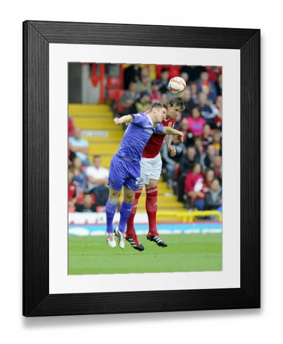 Framed Print : Aden Flint vs. Kevin Doyle: A Lofted Duel at Ashton Gate