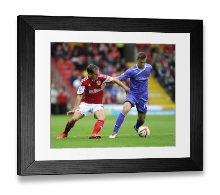 Framed Print : Neil Kilkenny vs. Lee Evans: Intense Battle for Ball Possession in Bristol City vs. Wolves