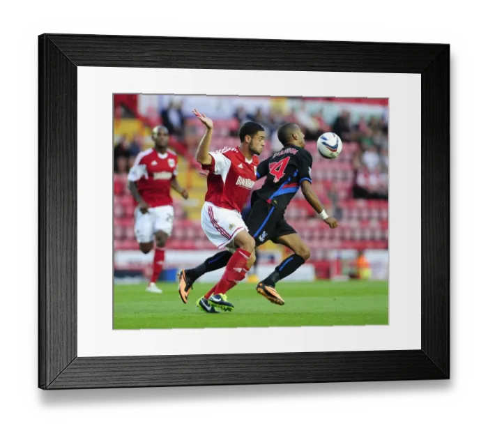 Framed Print : Bristol City vs Crystal Palace: Intense Moment as Elliot Grandin Contends with Derrick Williams Pressure