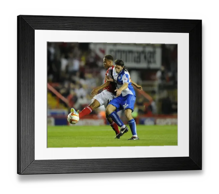 Framed Print : Bristol Derby: Bobby Reid vs John-Joe O'Toole Clash in Bristol City V Bristol Rovers Johnstone's Paint Trophy Match