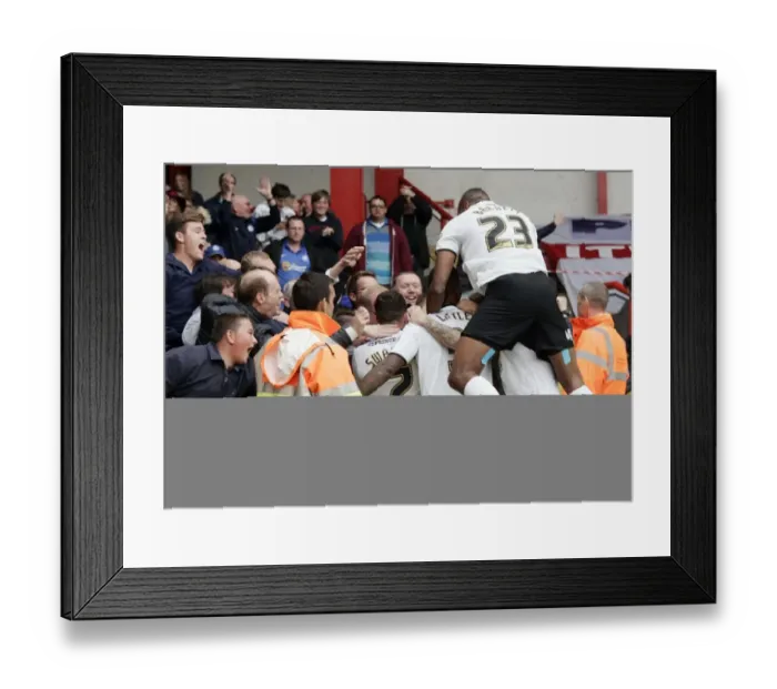 Framed Print : Thrilling Goal Celebration: Britt Assombalonga's Strike for Bristol City Against Peterborough United