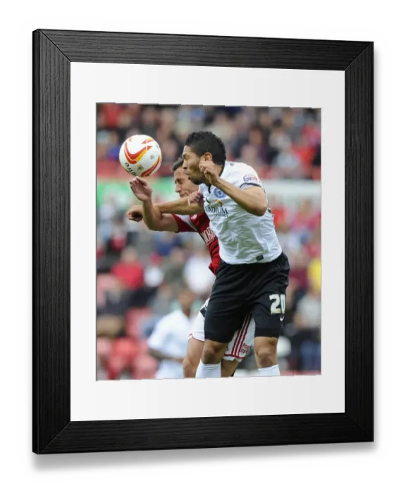 Framed Print : Battling for Supremacy: Sam Baldock vs. Nat Knight-Percival in the Sky Bet League One Clash between Bristol City and Peterborough United