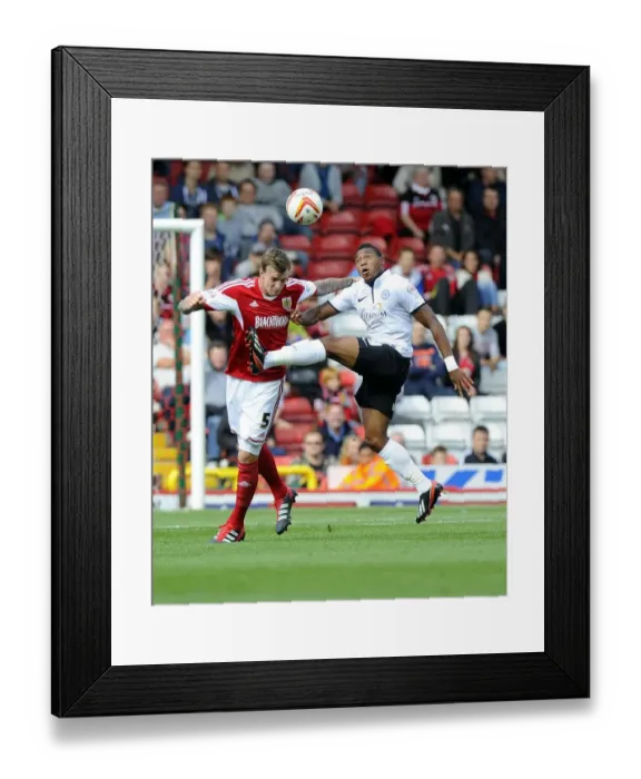 Framed Print : Intense Aerial Battle: Flint vs Assombalonga - Football Rivalry in the Sky (Bristol City vs Peterborough)