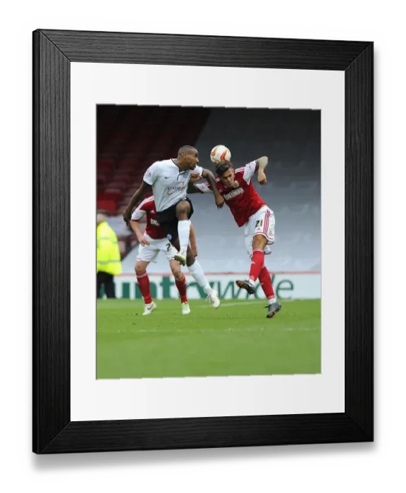 Framed Print : Battling for Supremacy: Marlon Pack vs. Tyrone Barnett in the Sky Bet League One Clash between Bristol City and Peterborough United