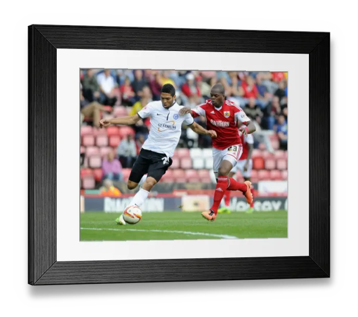 Framed Print : Battling for Supremacy: Marlon Harewood vs. Nat Knight-Percival in the Thrilling Bristol City vs. Peterborough United Clash Framed Print : Battling for Supremacy: Marlon Harewood vs. Nat Knight-Percival in the Thrilling Bristol City vs. Peterborough United Clash