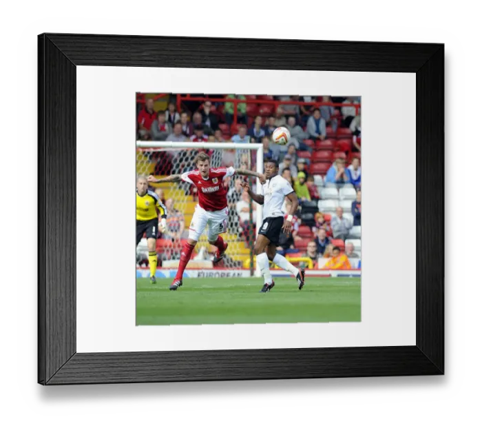 Framed Print : Intense Aerial Battle: Flint vs Assombalonga - Football Rivalry in the Sky (Bristol City vs Peterborough) Framed Print : Intense Aerial Battle: Flint vs Assombalonga - Football Rivalry in the Sky (Bristol City vs Peterborough)