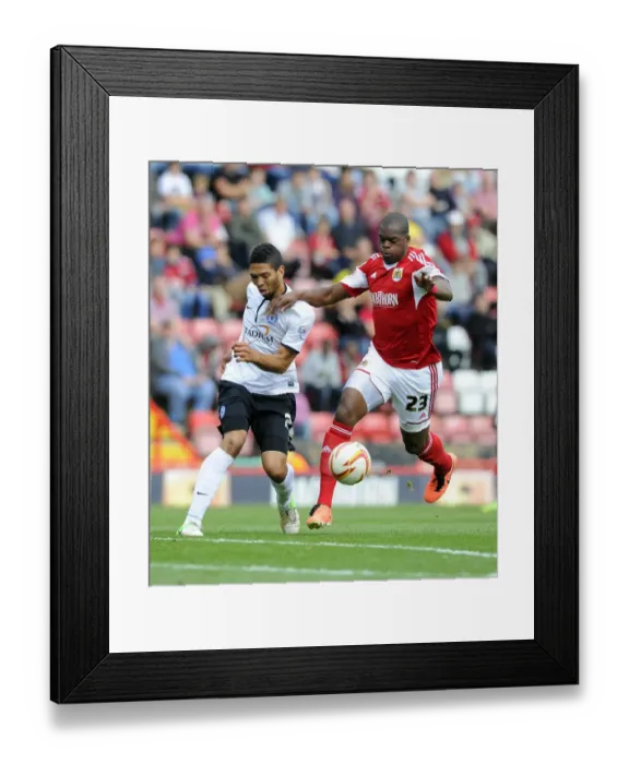 Framed Print : Battling for Supremacy: Harewood vs. Knight-Percival in Bristol City vs. Peterborough United Framed Print : Battling for Supremacy: Harewood vs. Knight-Percival in Bristol City vs. Peterborough United