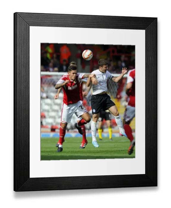 Framed Print : Maron Pack vs. Tommy Rowe: Aerial Clash in Bristol City vs. Peterborough United Framed Print : Maron Pack vs. Tommy Rowe: Aerial Clash in Bristol City vs. Peterborough United