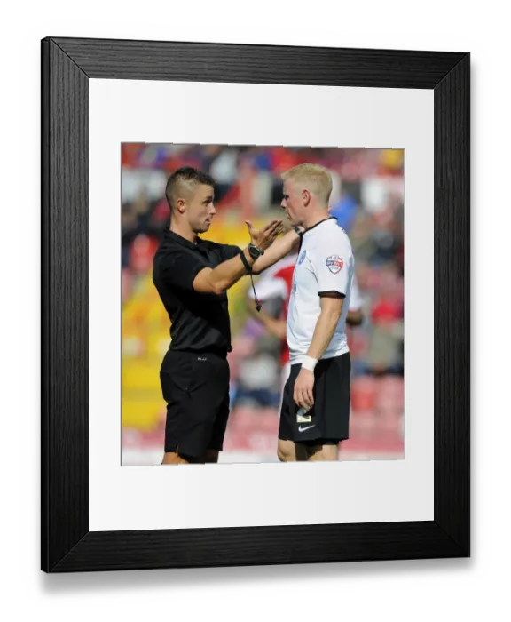 Framed Print : Referee James Adcock Confers with Craig Alcock of Peterborough United during Bristol City vs Peterborough United, Sky Bet League One (Football Match)