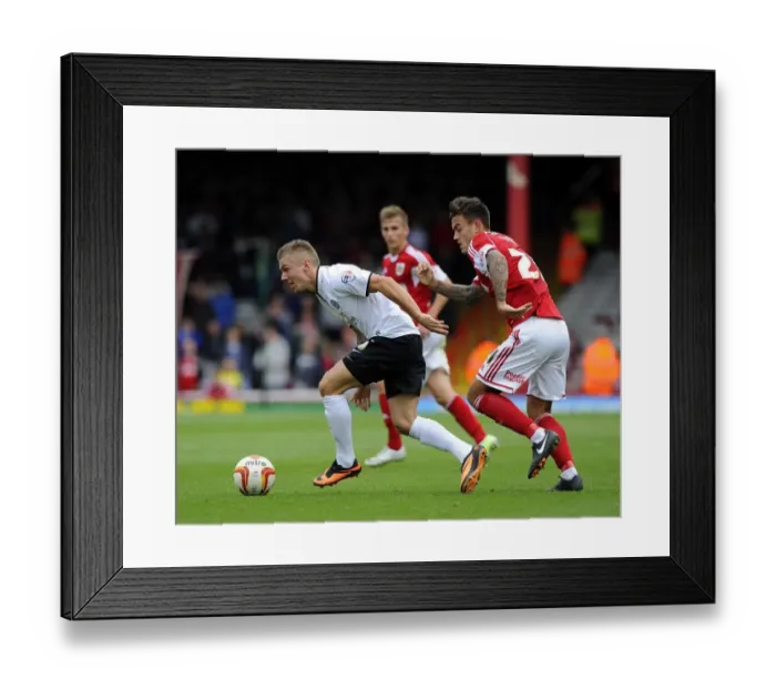 Framed Print : Battling for Supremacy: Marlon Pack vs Jack Payne in Bristol City vs Peterborough United Clash