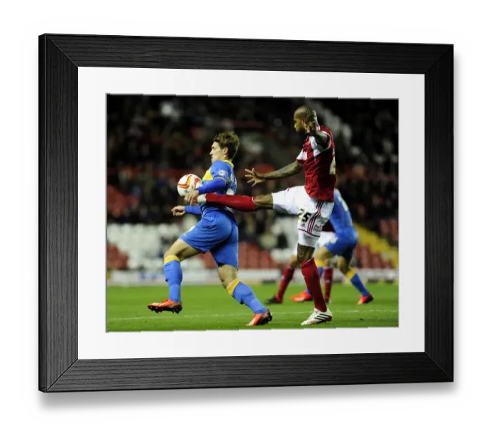 Framed Print : Intense Rivalry: Marvin Elliott vs Tom Bradshaw - Battle for Ball Control at Ashton Gate Framed Print : Intense Rivalry: Marvin Elliott vs Tom Bradshaw - Battle for Ball Control at Ashton Gate