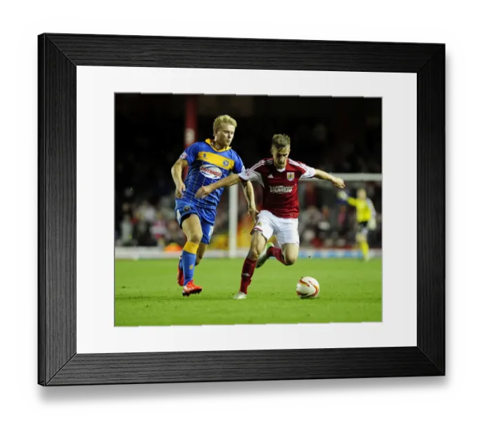 Framed Print : Intense Rivalry: Joe Bryan vs Curtis Main - Sky Bet League One Clash at Ashton Gate Framed Print : Intense Rivalry: Joe Bryan vs Curtis Main - Sky Bet League One Clash at Ashton Gate