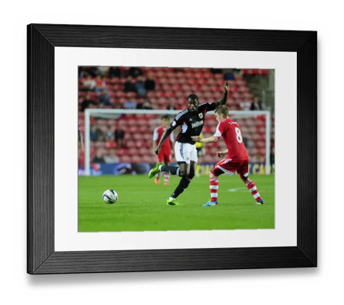 Framed Print : Bristol City's Jay Emmanuel-Thomas and Stephen McLaughlin Exchange a One-Two at Southampton's St Marys Stadium during the Capital One Cup Match