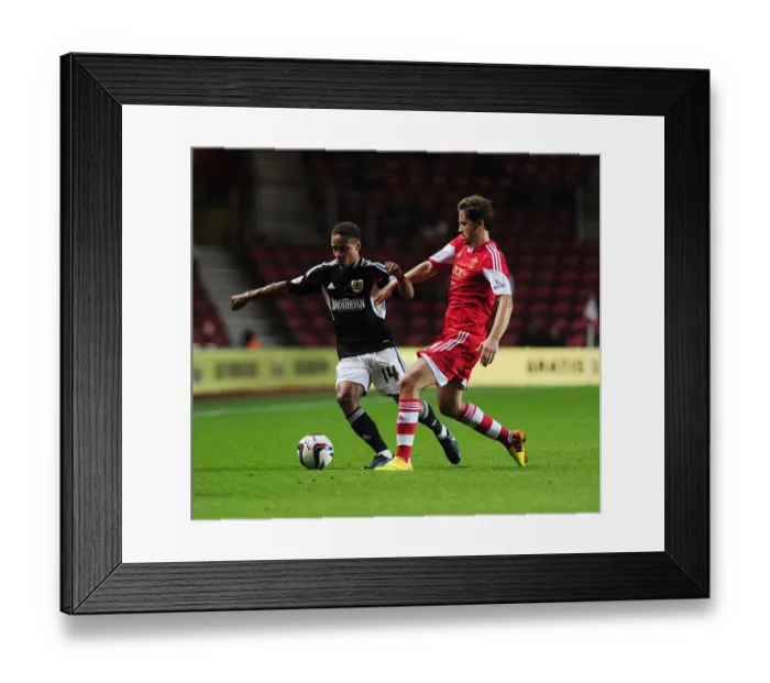 Framed Print : Bobby Reid vs. Gastón Ramirez: Intense Clash in Southampton vs. Bristol City Football Match, September 2013