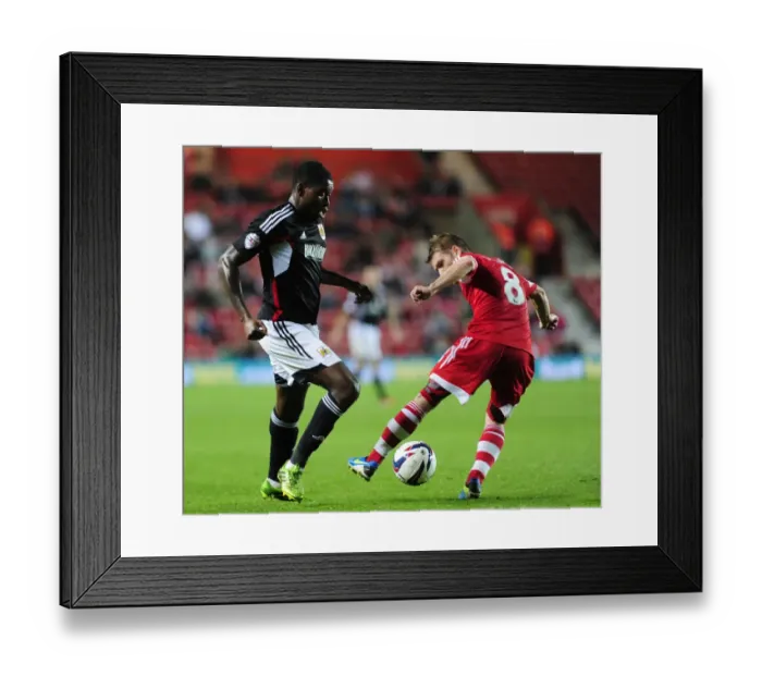 Framed Print : Jay Emmanuel-Thomas of Bristol City Passes Past Steven Davis of Southampton during Capital One Cup Match Framed Print : Jay Emmanuel-Thomas of Bristol City Passes Past Steven Davis of Southampton during Capital One Cup Match