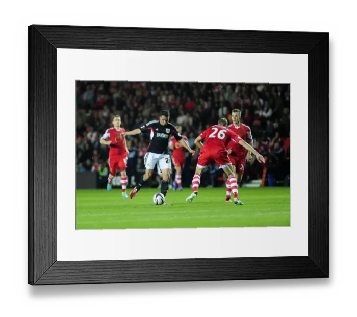 Framed Print : Bristol City's McLaughlin Charges Past Hooiveld in Southampton Showdown Framed Print : Bristol City's McLaughlin Charges Past Hooiveld in Southampton Showdown