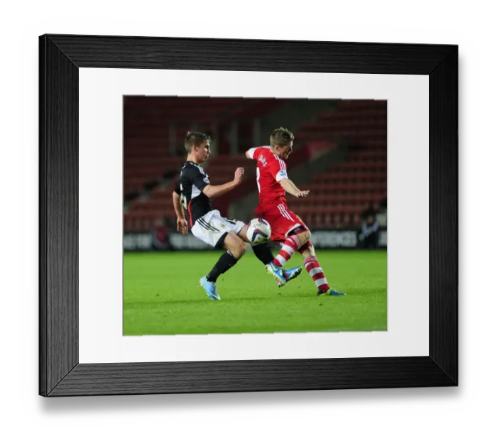 Framed Print : Southampton's Steven Davis Blocks Joe Bryan's Shot in Southampton V Bristol City, Capital One Cup