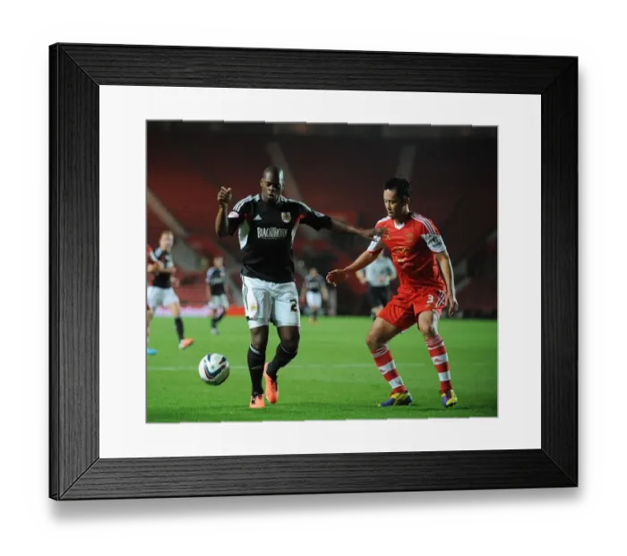 Framed Print : Marlon Harewood vs Maya Yoshida: A Battle at St. Mary's Stadium, Southampton vs Bristol City, 2013
