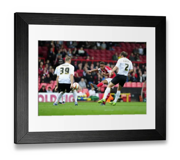 Framed Print : Bobby Reid Goes for Glory: Bristol City vs Colchester United, 2013