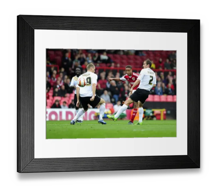 Framed Print : Bobby Reid's Shot at Glory: Bristol City vs Colchester United, 2013
