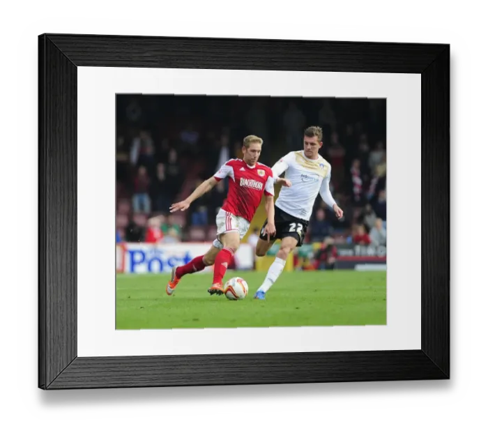 Framed Print : Bristol City's Scott Wagstaff Sprints Past Colchester United's Alex Gilbey in League One Clash