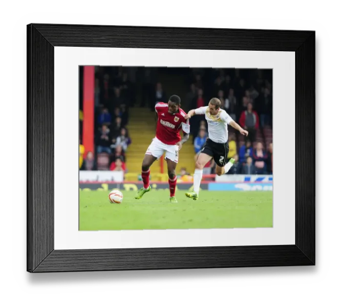 Framed Print : Intense Rivalry on the Pitch: Emmanuel-Thomas vs. Wright Framed Print : Intense Rivalry on the Pitch: Emmanuel-Thomas vs. Wright