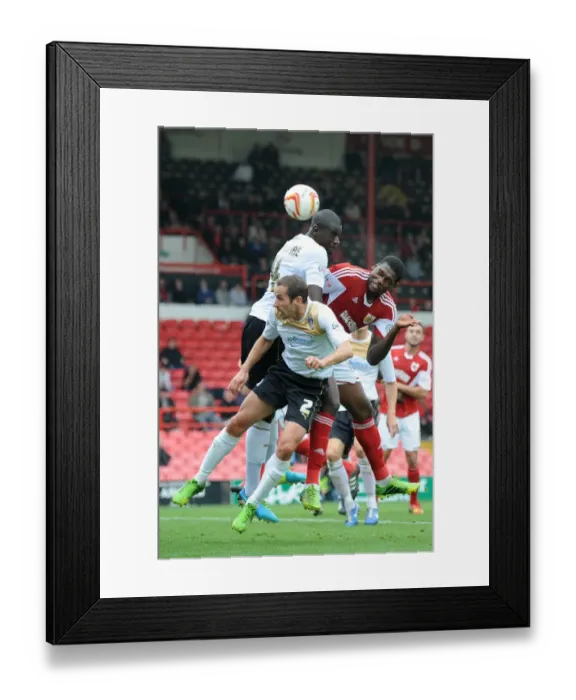 Framed Print : Bristol City's Jay Emmanuel-Thomas Leaps for a Header in Sky Bet League One Clash Against Colchester United Framed Print : Bristol City's Jay Emmanuel-Thomas Leaps for a Header in Sky Bet League One Clash Against Colchester United