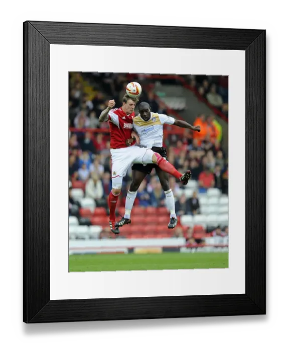 Framed Print : Aden Flint vs Jabo Ibehre: Battle for Supremacy in Bristol City vs Colchester United (Sky Bet League One, 2013) Framed Print : Aden Flint vs Jabo Ibehre: Battle for Supremacy in Bristol City vs Colchester United (Sky Bet League One, 2013)
